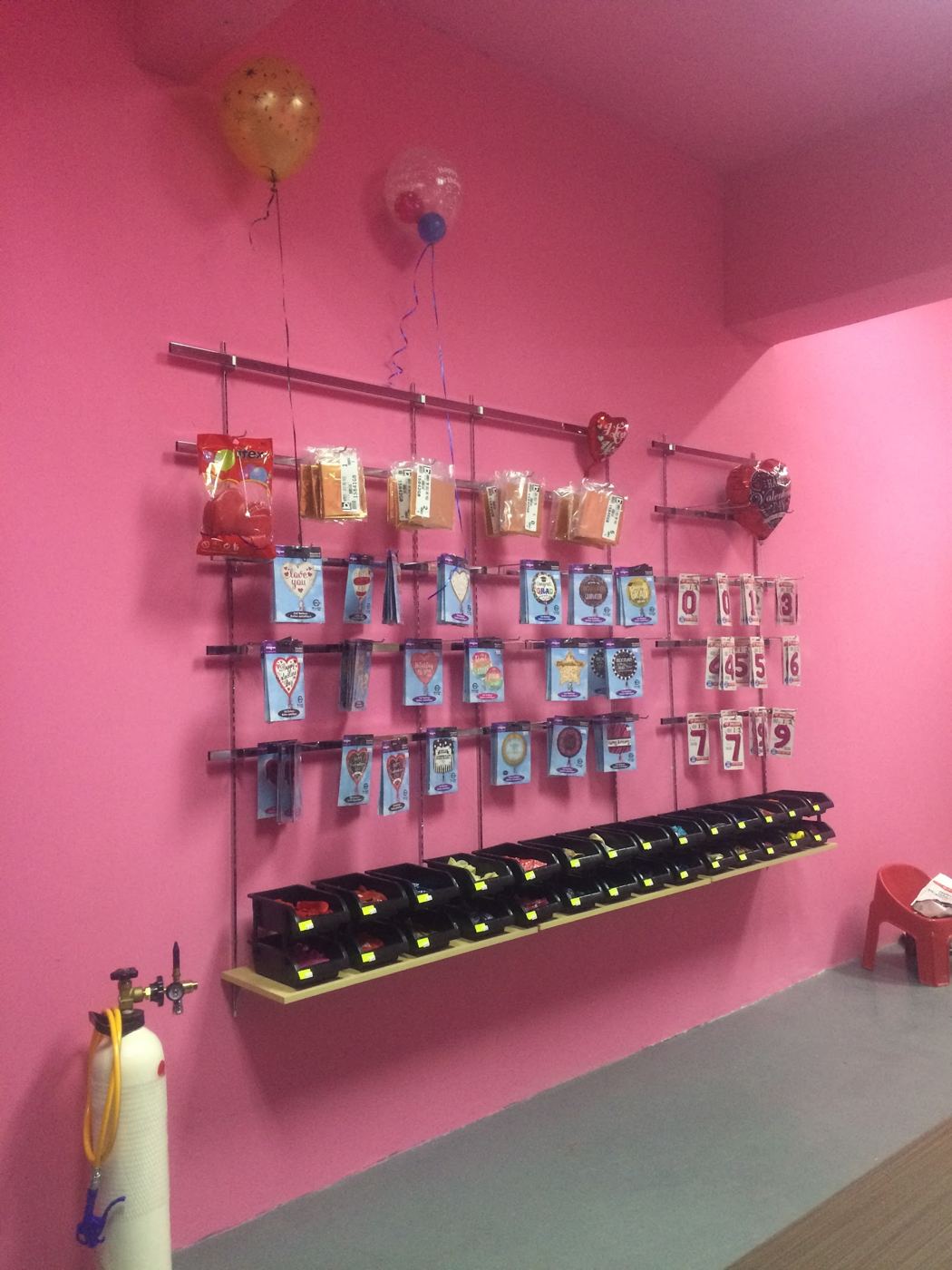Pink wall with foil balloons